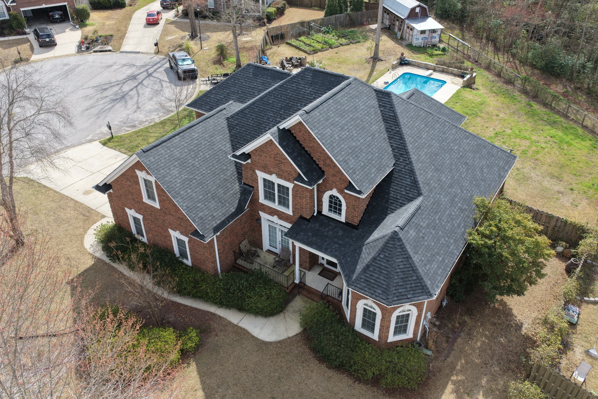 Completed Owens Corning shingle roof on a brick home